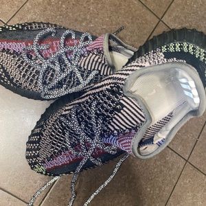 Adidas Yeezy’s size 8 in men’s. Main color is black and multi color streaks.